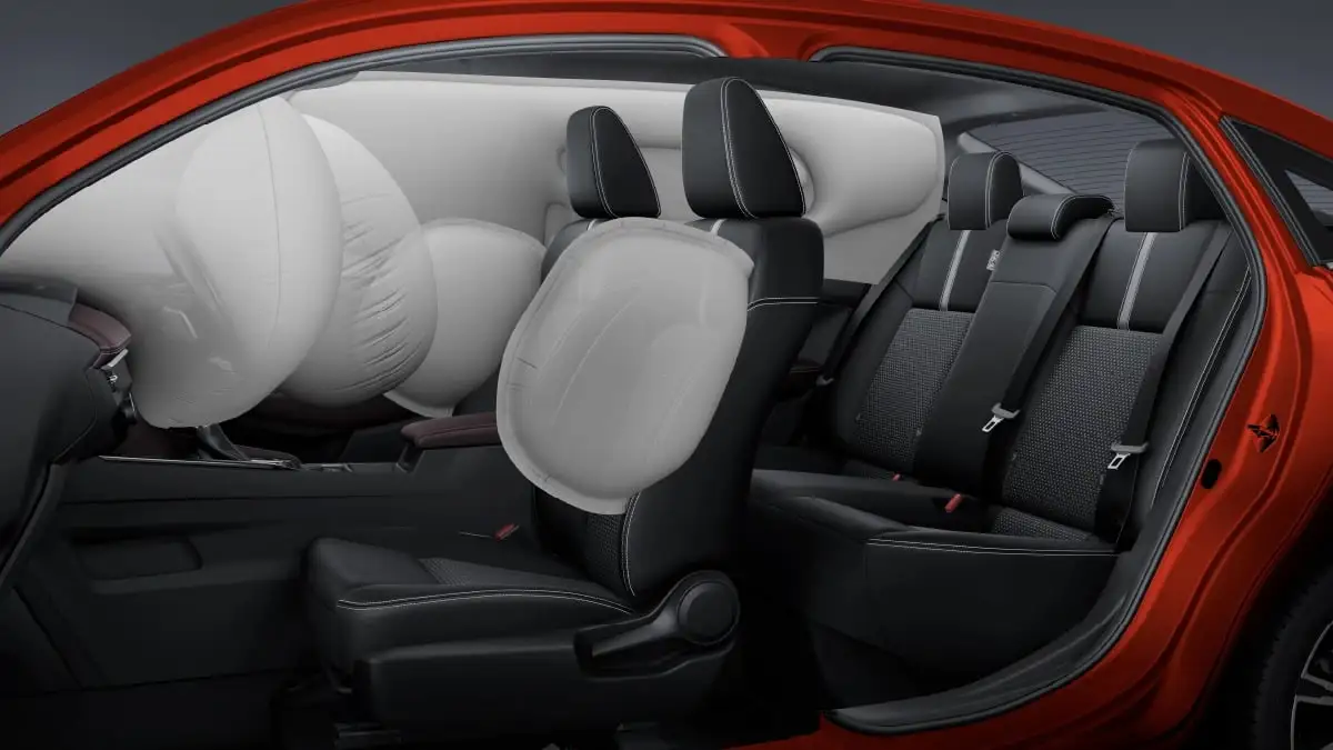 Red Toyota Vios cutaway showing driver and passenger airbag protection with full interior safety features