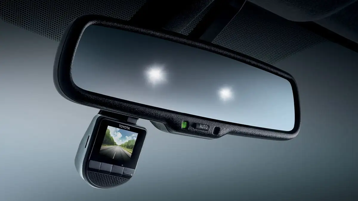 Toyota electrochromic rearview mirror with integrated dash cam displaying road footage and auto-dimming technology