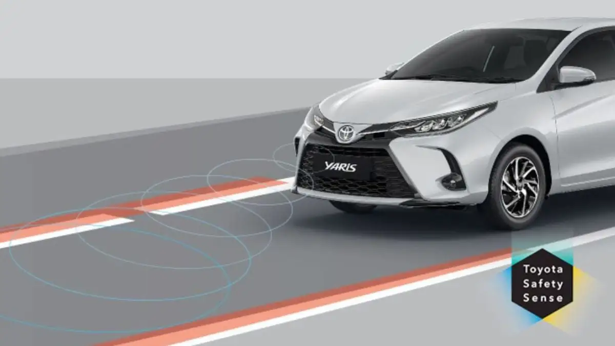 Toyota Yaris with Safety Sense lane departure alert system showing detection zones and warning visualization