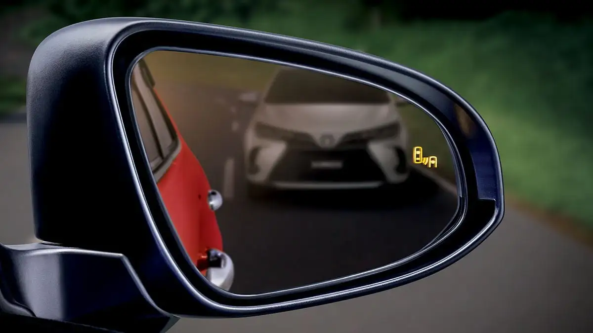 Side mirror of Toyota Yaris with Blind Spot Monitor (BSM) with Rear Cross Traffic Alert (RCTA)