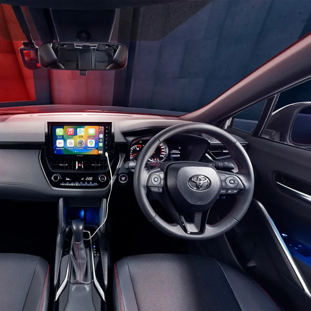 Toyota Corolla Cross GR Sport interior dashboard view with smartphone connectivity and modern infotainment display