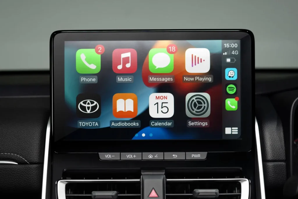 Modern infotainment system in Toyota Innova Zenix featuring Apple CarPlay integration and media controls