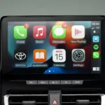 Modern infotainment system in Toyota Innova Zenix featuring Apple CarPlay integration and media controls
