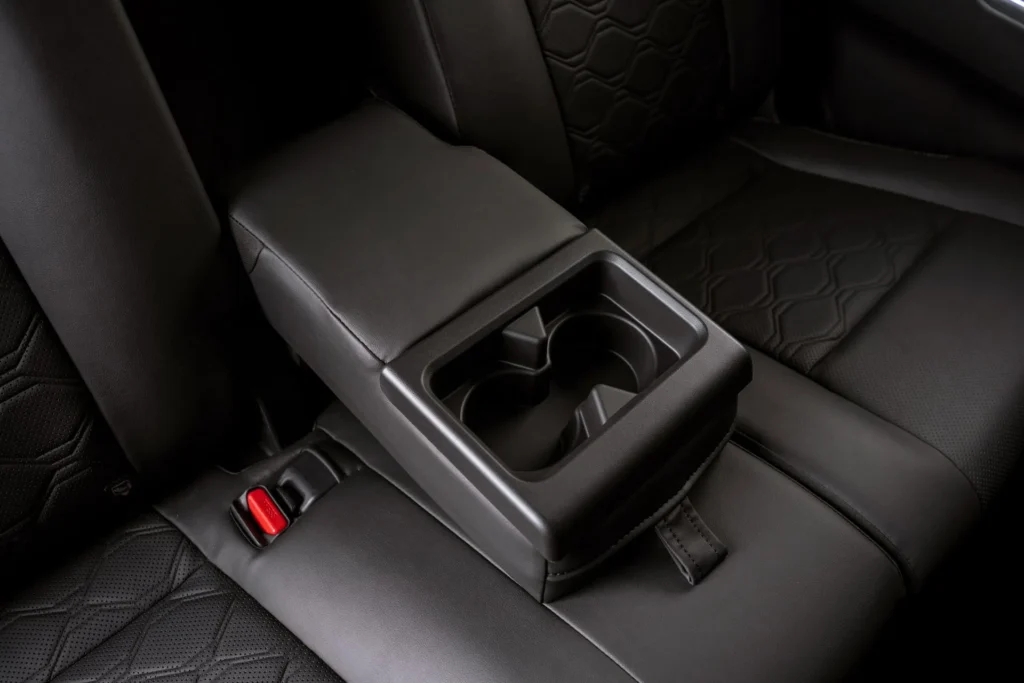Center console convenience features in Toyota Innova Zenix showcasing passenger comfort and storage solutions