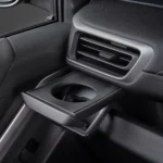 Toyota Innova Zenix rear air conditioning vents with fold-down cup holder for passenger comfort amenities