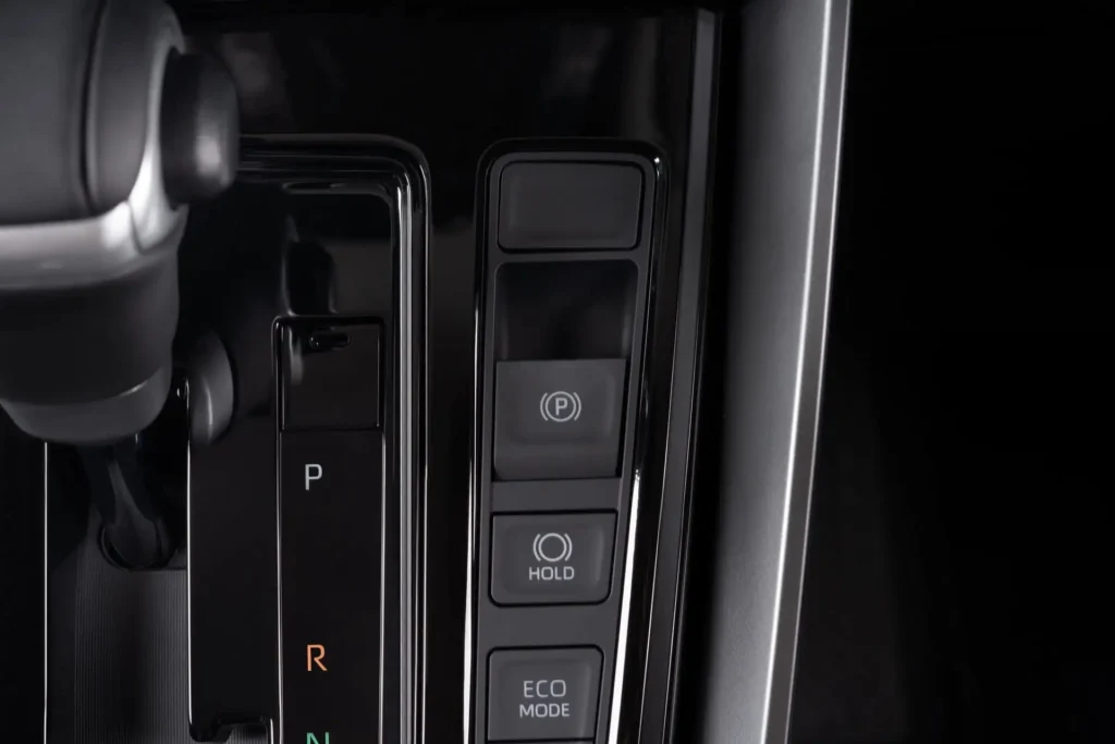 Center console of Toyota Innova Zenix displaying automatic transmission shifter and driving mode options