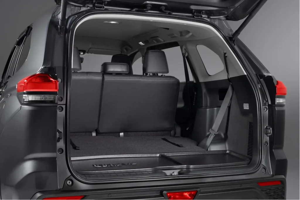 Spacious trunk area of Toyota Innova Zenix with open tailgate showing practical loading space accessibility
