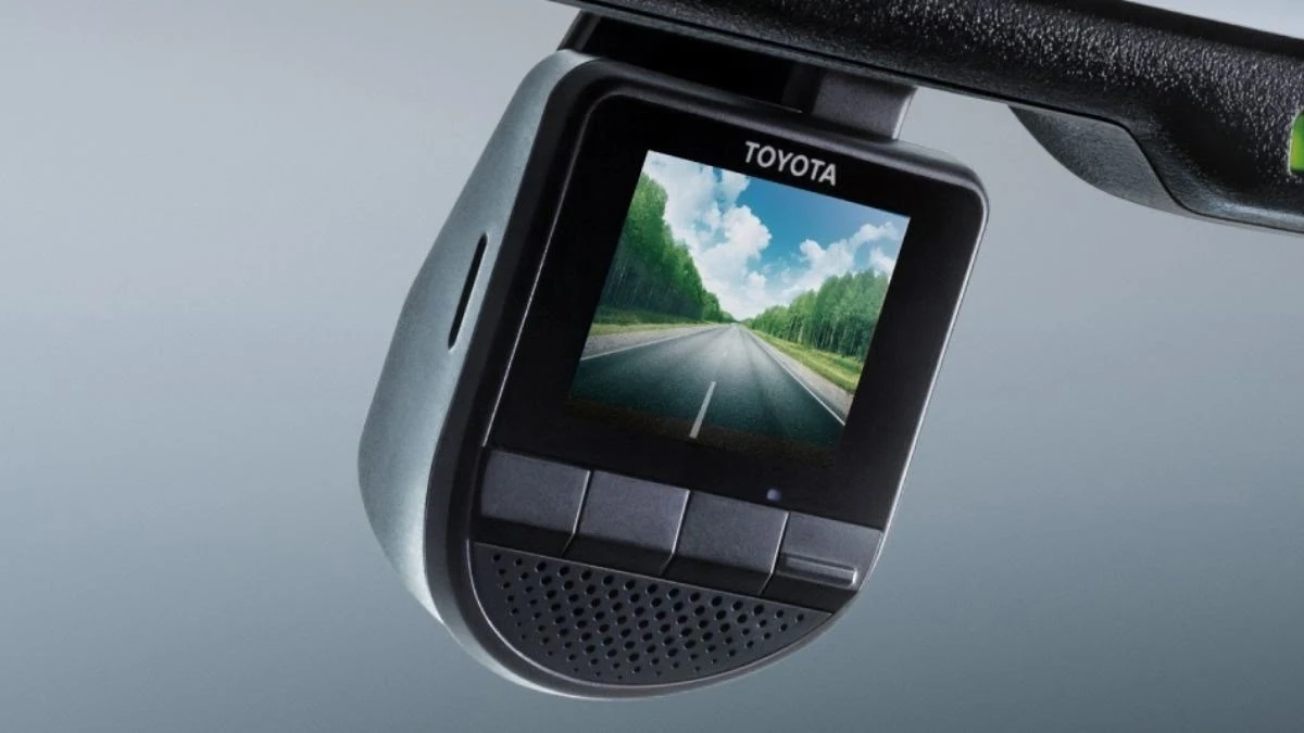 Toyota Camry Front Digital Video Recorder (DVR) showing forest road view on small LCD screen with control buttons beneath