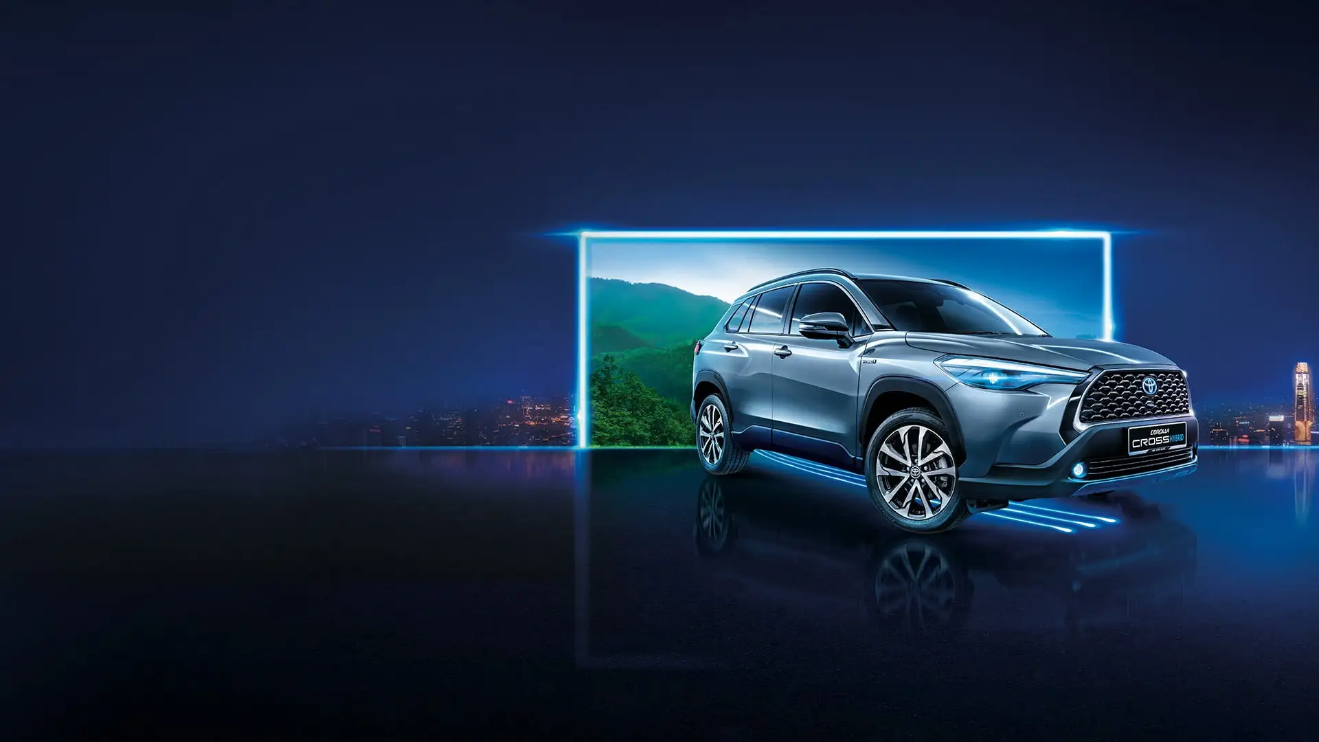 Silver Toyota Corolla Cross Hybrid Electric in futuristic studio with blue neon lighting and mountain landscape backdrop