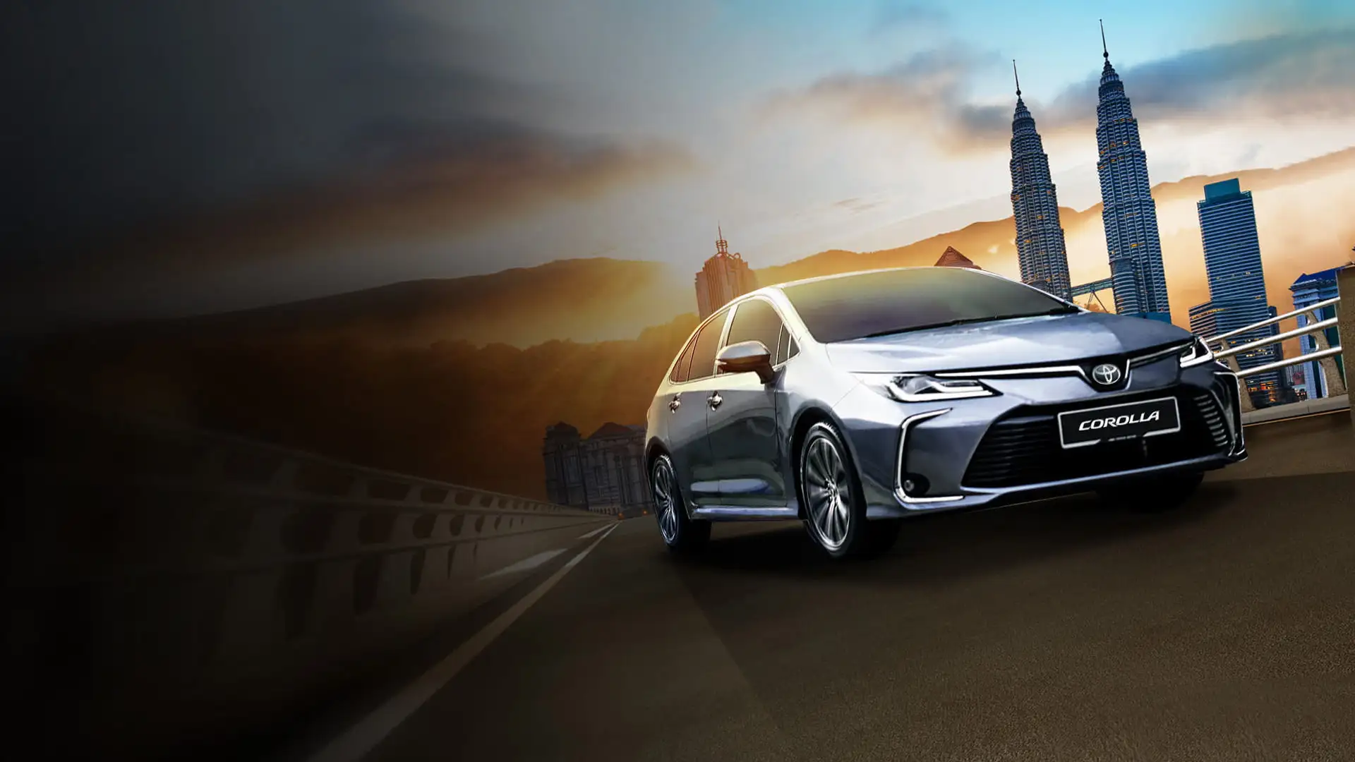 Silver Toyota Corolla on highway at sunset with Petronas Twin Towers and Kuala Lumpur skyline in background