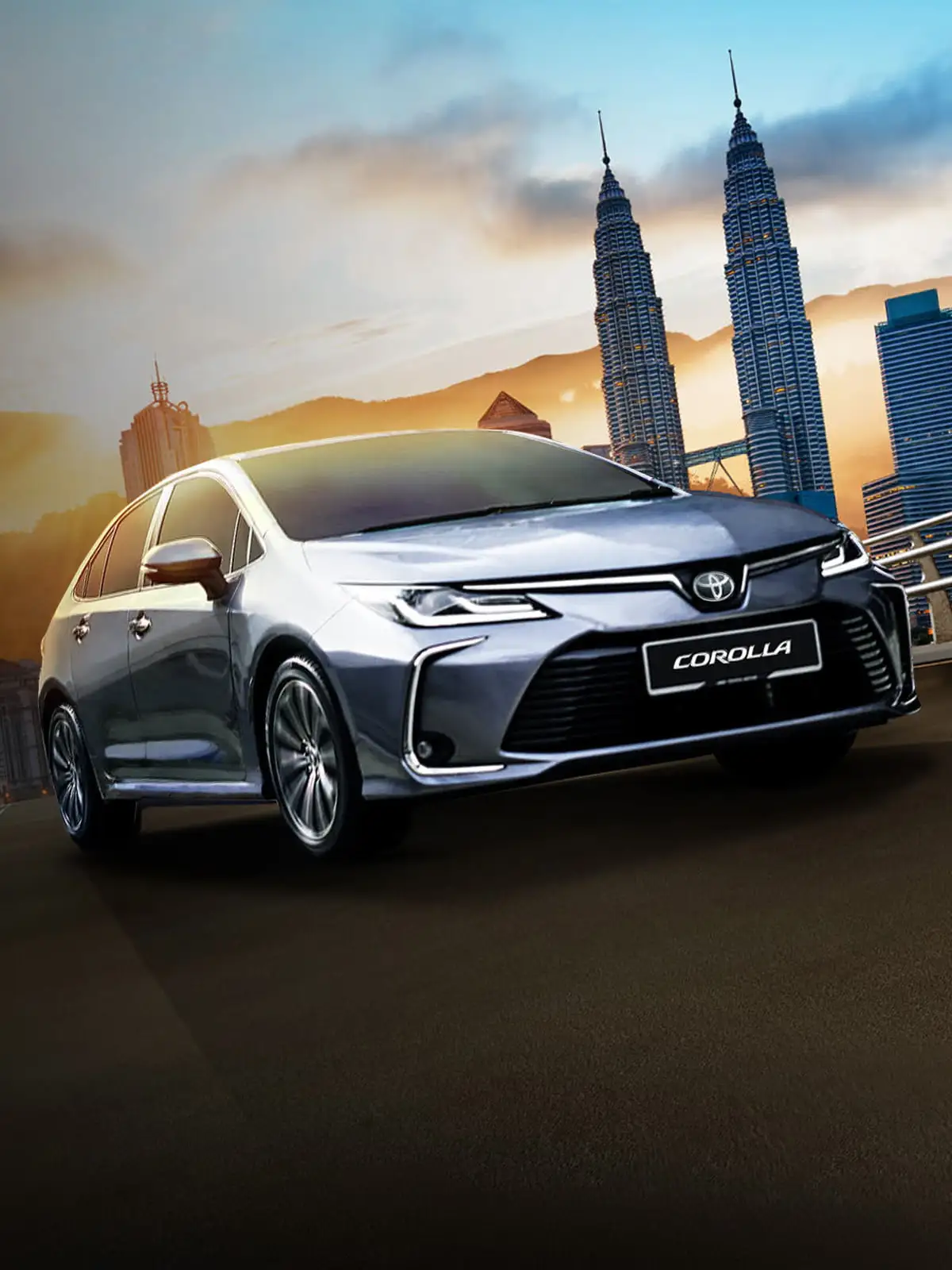 Silver Toyota Corolla on highway at sunset with Petronas Twin Towers and Kuala Lumpur skyline in background