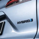 Toyota Corolla Cross Hybrid Electric body panel showing Cross and Hybrid badging with blue accent detailing