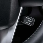 Close-up of Toyota Fortuner cruise control interface with ergonomic button layout and premium steering wheel design