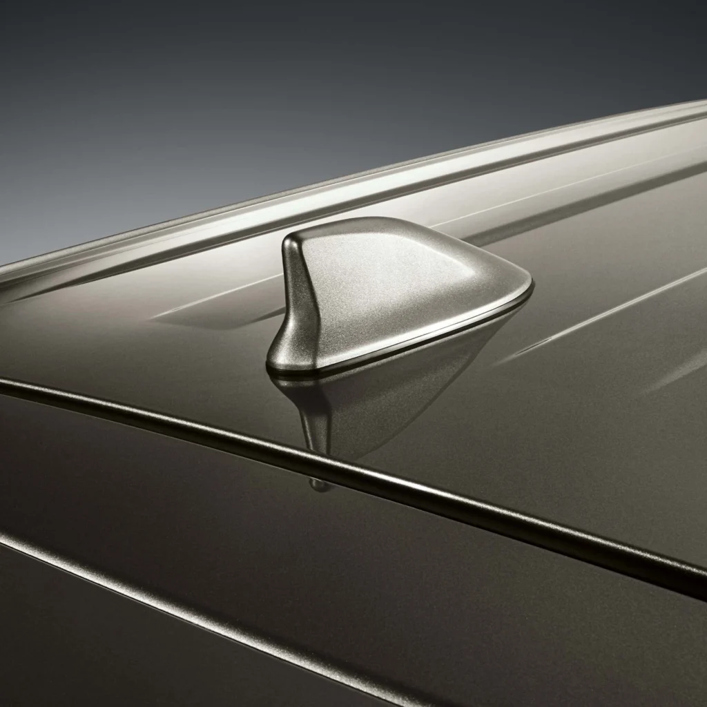 Modern roof-mounted antenna system on Toyota Innova featuring streamlined design and connectivity features