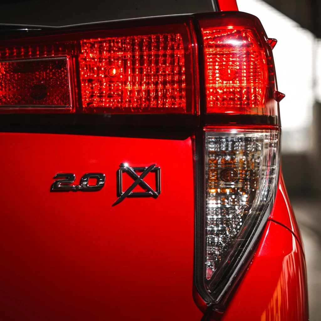Toyota Innova LED taillight detail showing modern lighting technology with distinctive red illumination pattern