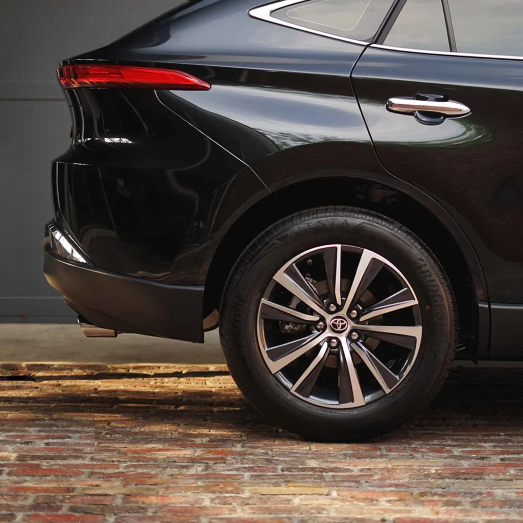 Close-up view of Toyota Harrier wheel featuring multi-spoke alloy rim design and performance tire setup