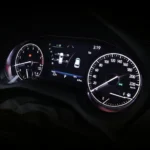 Toyota Harrier instrument cluster displaying speedometer, tachometer, and digital information screen with vehicle status