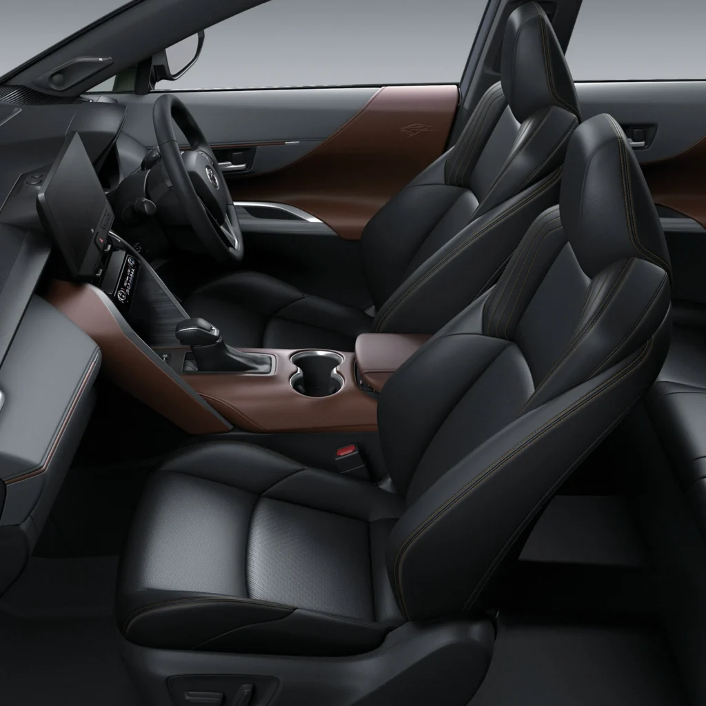 Toyota Harrier front interior view displaying black leather seats with brown trim and spacious cabin layout