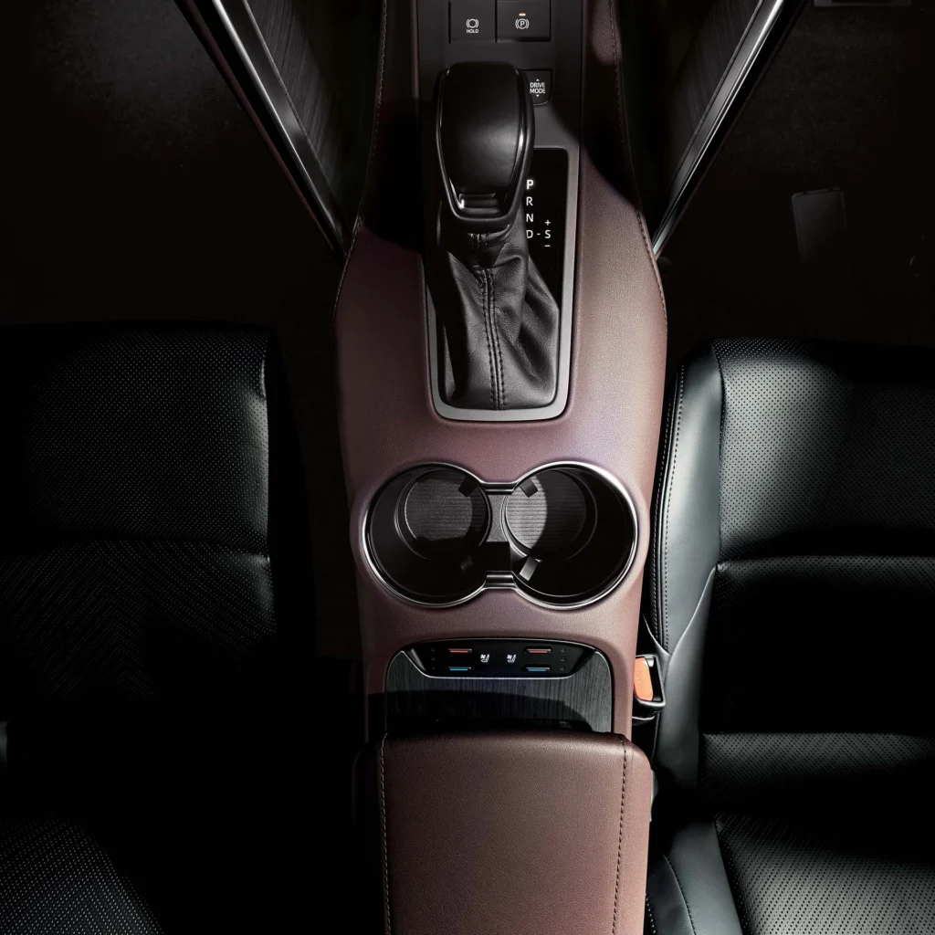 Toyota Harrier automatic transmission shifter with PRND controls and dual cup holders in center console