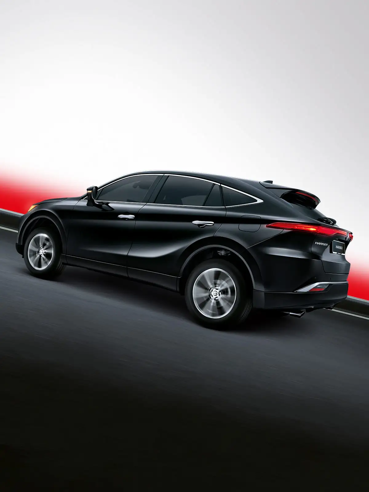 Black Toyota Harrier SUV driving on curved road with dramatic red lighting and modern sporty design profile