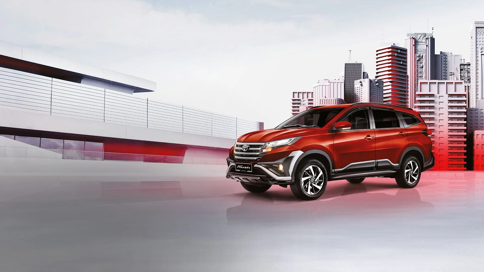 Modern Toyota Rush exterior design featuring bold front grille and alloy wheels in contemporary urban setting