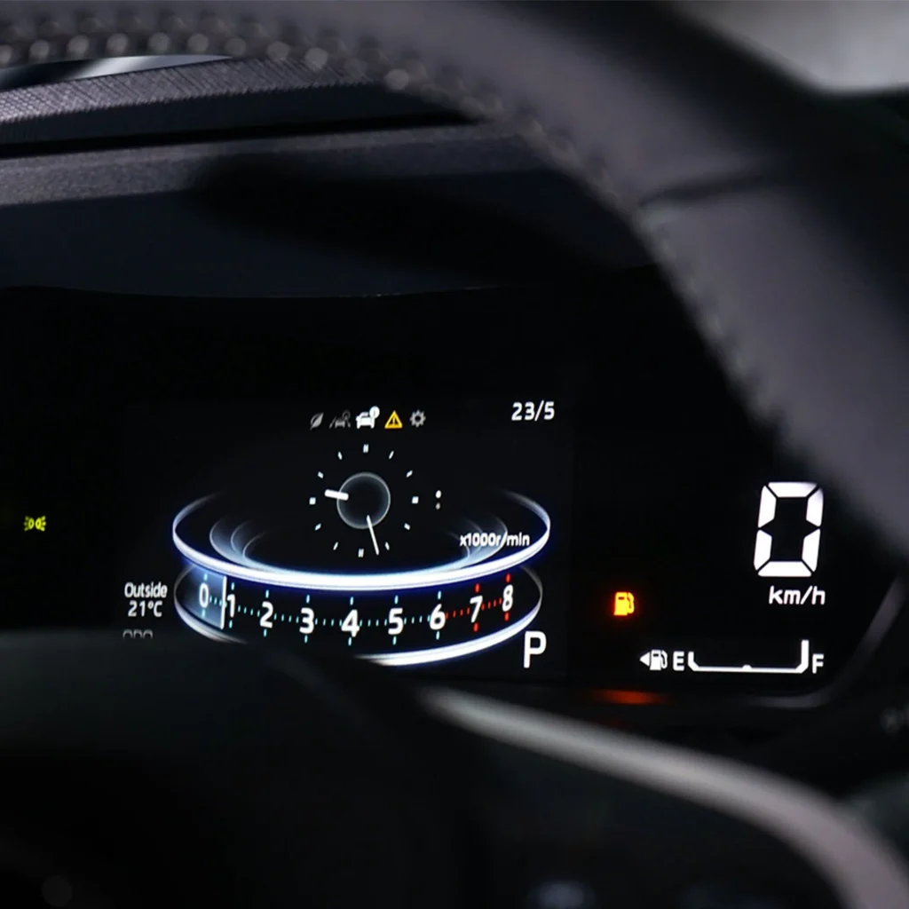 Toyota Veloz digital instrument cluster dashboard displaying speedometer, fuel gauge and warning indicators