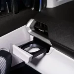 Car interior cup holder detail in Toyota Veloz showing practical storage solutions and modern design elements